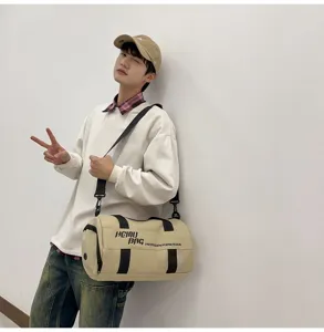 Large capacity cylindrical sports duffel bag for fitness, travel, and daily outdoor activities.