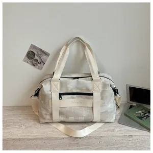 Large capacity travel duffel bag for gym and yoga with durable pu texture material and straps.