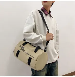 Detailed view of the khaki cylindrical sports duffel bag, perfect for travel and gym use.