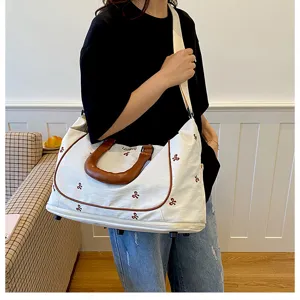 Canvas travel duffel bag large capacity weekend overnight bag with bow embroidery shoulder strap