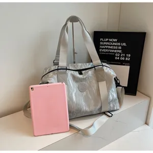 Large capacity silver travel duffel bag with durable straps for gym yoga and outdoor sports.