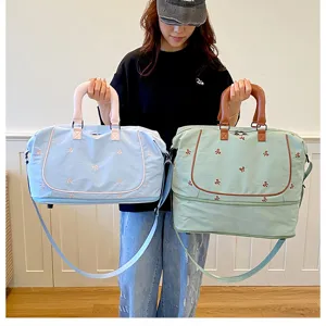 Large capacity travel duffel bag with bow embroidery, perfect for short trips and gym.