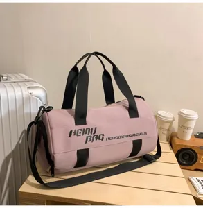 Pink duffel bag for sports, fitness, and travel. Large capacity gym bag with wet dry separation.