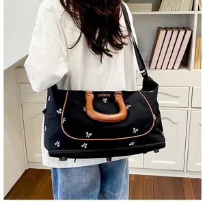 Large capacity canvas travel bag with bow prints, expandable duffel bag for short trips.
