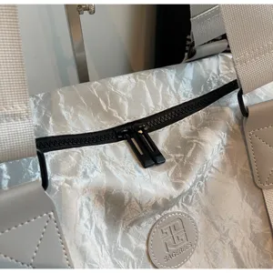 Crinkled PU leather travel duffel bag detail, large capacity gym bag with durable zipper.