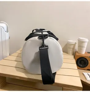 White cylindrical gym duffel bag with black straps for travel and sports fitness.