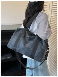 Large capacity travel duffel bag with textured design, versatile sports fitness handbag.