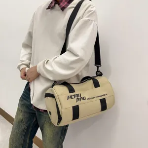 Beige cylindrical sports duffel bag, large capacity fitness gym bag for travel and sports.