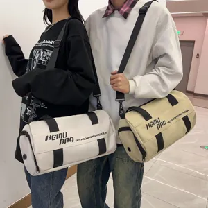 Large capacity cylindrical sports duffel bag for travel, fitness, and daily gym use.
