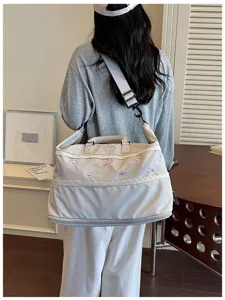 Large capacity travel duffel bag with lace trim, expandable gym bag for fitness and swimming.