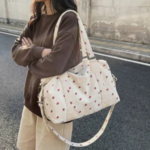 Large capacity corduroy travel duffel bag with cute strawberry print, casual weekender bag.
