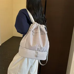 Sac a dos impermeable avec cordon de serrage et grande capacite pour sport et plage.