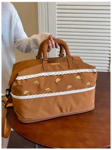 Large capacity travel duffel bag with lace trim and cute embroidery for gym and outdoor use.