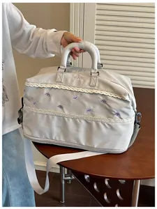 Large capacity grey travel duffel bag with lace trim and cute purple embroidery details.