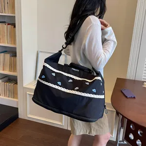 Large capacity black travel duffel bag with white lace trim and cute blue cloud embroidery for women.