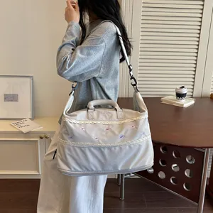 Large capacity travel gym bag with cute embroidery and lace trim for women daily use.