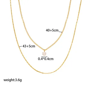 Minimalist double-layer golden necklace with small diamond pendant and size details