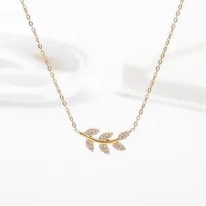 Elegant gold-plated stainless steel branch necklace featuring a sparkling rhinestone leaf pendant