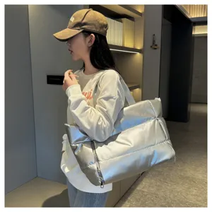 Stylish silver puffy tote bag for women, large capacity waterproof travel gym duffel bag.
