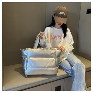 Silver puffer tote bag for women, stylish down cotton shoulder handbag for casual daily use.