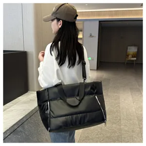 Black puffer gym bag for women, waterproof travel tote, wet dry separation yoga sports bag.