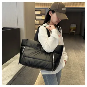Black puffer tote bag for women, stylish quilted shoulder bag for fitness, travel and daily use.