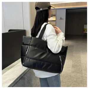 Large capacity black quilted gym tote bag, stylish shoulder bag for travel and fitness.