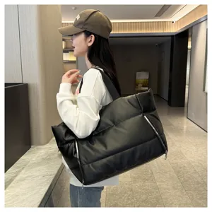 Black puffer tote bag for women, large capacity travel duffel and fitness gym shoulder bag.