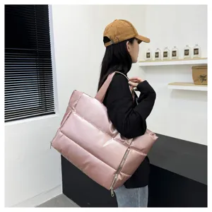 Pink puffer tote bag for women, large capacity shoulder gym bag for sports and travel.