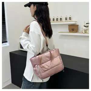 Stylish pink padded gym bag for women, waterproof travel shoulder bag and yoga tote.