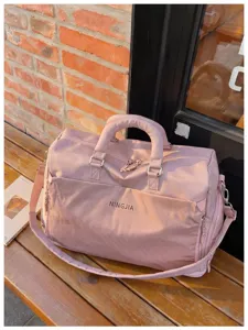 Pink large capacity travel duffel bag waterproof sports gym bag with shoulder strap.