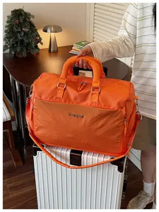 Large capacity travel duffel bag for short business trips, expandable, with wet-dry pocket.