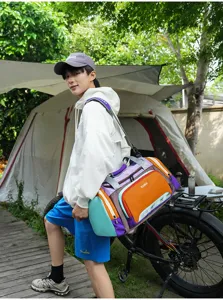 Outdoor travel duffel bag detail, showing spacious capacity and stylish color block design.