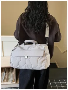 Large capacity travel duffel bag for women, lightweight waterproof fitness gym bag for short trips.