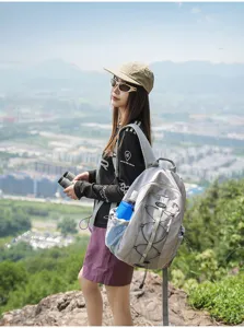 Outdoor hiking backpack detail view, large capacity grey rucksack with mesh side pockets.