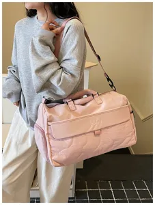 Pink large capacity travel duffel bag for women, waterproof fitness sports shoulder bag.