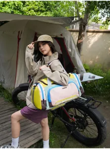 Detail view of large capacity travel duffel bag in outdoor camping setting for sports fitness.