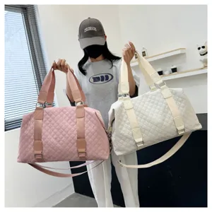 Quilted travel duffel bag for women, large capacity fitness gym bag with shoulder strap.
