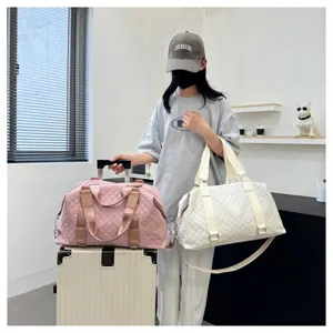 Large capacity quilted travel duffel bag with shoulder strap for women fitness gym.