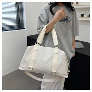 Detailed view of the stylish quilted gym travel duffel bag for women, large capacity.