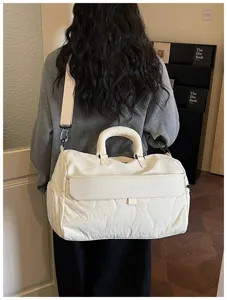 Large capacity travel duffel bag for women lightweight water-resistant gym fitness shoulder bag.