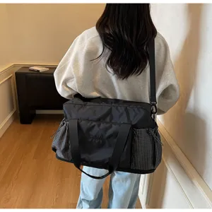 Travel duffel bag for women large capacity gym bag with wet dry separation and plaid side pockets.