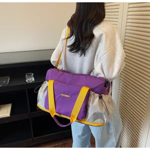 Detail view of the purple travel fitness bag showing back carrying and durable fabric style.