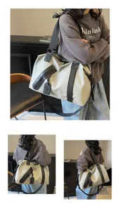 Grand sac de voyage de type duffel avec separation humide et seche pour sport et voyages d'affaires.