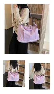 Large capacity travel bag for women, lightweight waterproof shoulder bag for daily use.