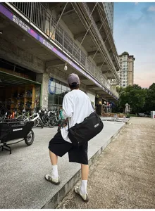 Large capacity travel duffel bag with shoulder strap, ideal for outdoor trips and sports.