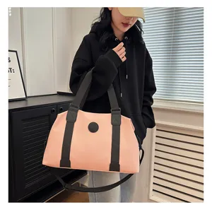 Pink oxford cloth fitness gym bag for women, large capacity travel duffel with black straps.