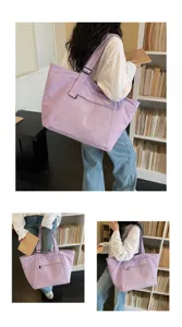 Casual purple canvas tote bag with front mesh pocket for daily commuting and travel use.