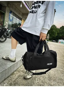 Black travel duffel bag large capacity portable crossbody gym bag for men and women daily use.