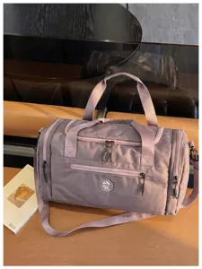 Waterproof travel duffel bag detail, dry-wet separation gym bag in soft purple color.